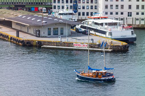 Bergen, Norway, June 29, 2023: The Bergen Port, pictured here in summer,  is an international seaport shared by commerical and recreational boats and is conists of  two bays, Vagen and Puddefjorden.