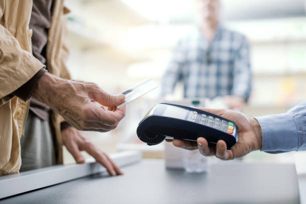 istock Senior man paying with a credit card 1864711845
