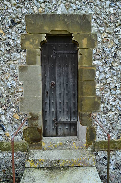 istock Narrow wooden door 186471616