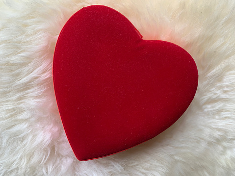 Red heart on the white fur