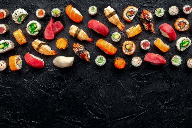 istock Sushi with a place for text. Many rolls, maki, nigiri etc, overhead flat lay 1864733340