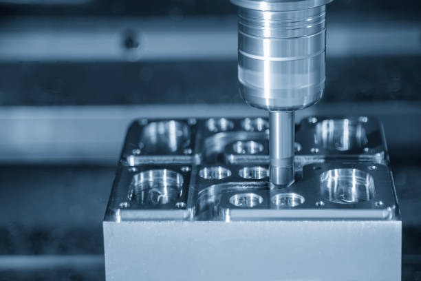 istock The CNC milling machine chamfer cutting mold base part by chamfer tool in the light blue scene. 1864754358