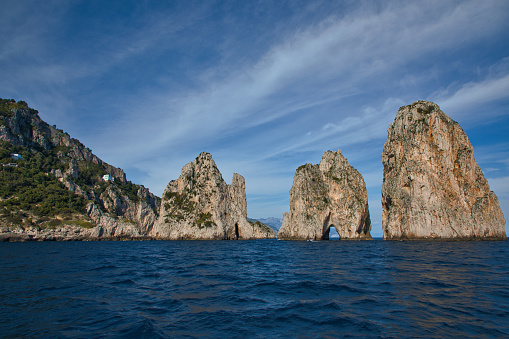 Rock gate in the sea, Punta di Tragara, Faraglioni, Capri, Gulf of Naples, Campania, Italy