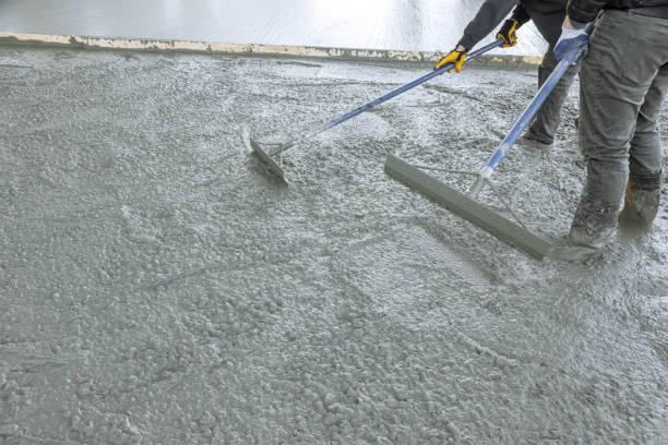 istock Concrete has been poured for a driveway of new house using wet cement 1864788657