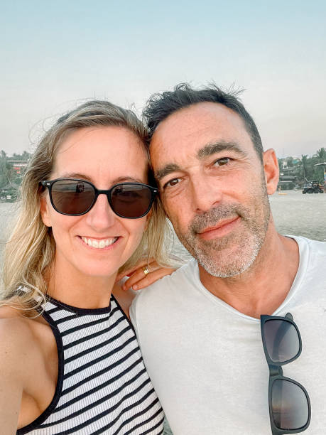 istock happy couple taking a selfie 1864809561
