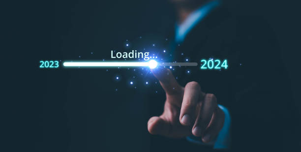 istock Businessman touch on loading progress from 2023 to 2024,Planning and challenge strategy in new year 2024 Concept. New business startup in 2024. New year 2024 is loading, calendar date, end of the year 1864818574