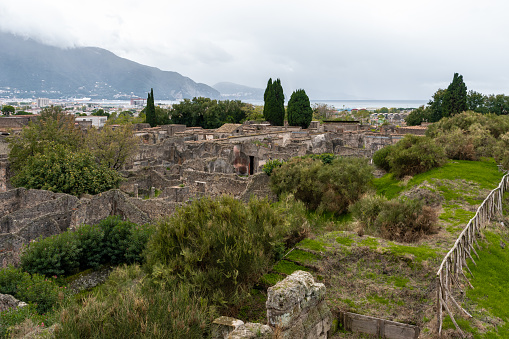 View of the ancient Pompeii with mountains and sea in the background