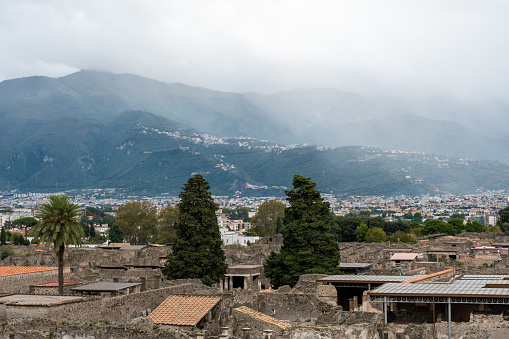 View of the ancient Pompeii with mountains in the background