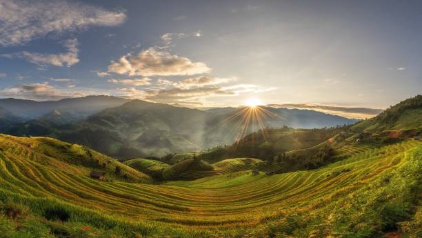 istock Majestic Peaks Unveiled: A Spellbinding Sunset Symphony with Floating Clouds 1864846340