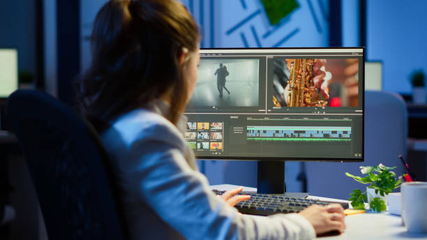 istock Video editor working at night at new project editing audio film montage 1864846983