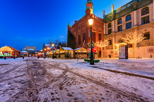 Gdansk, Poland - November 26, 2023: Beautifully lit Christmas fair (Jarmark in Polish) in the Main City of Gdansk at dawn. Poland
