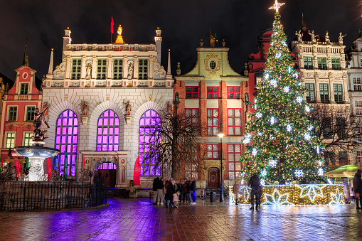 Gdansk, Poland - December 14, 2023: Christmas tree on the historic center of Gdansk at the Neptune Fountain, Poland.