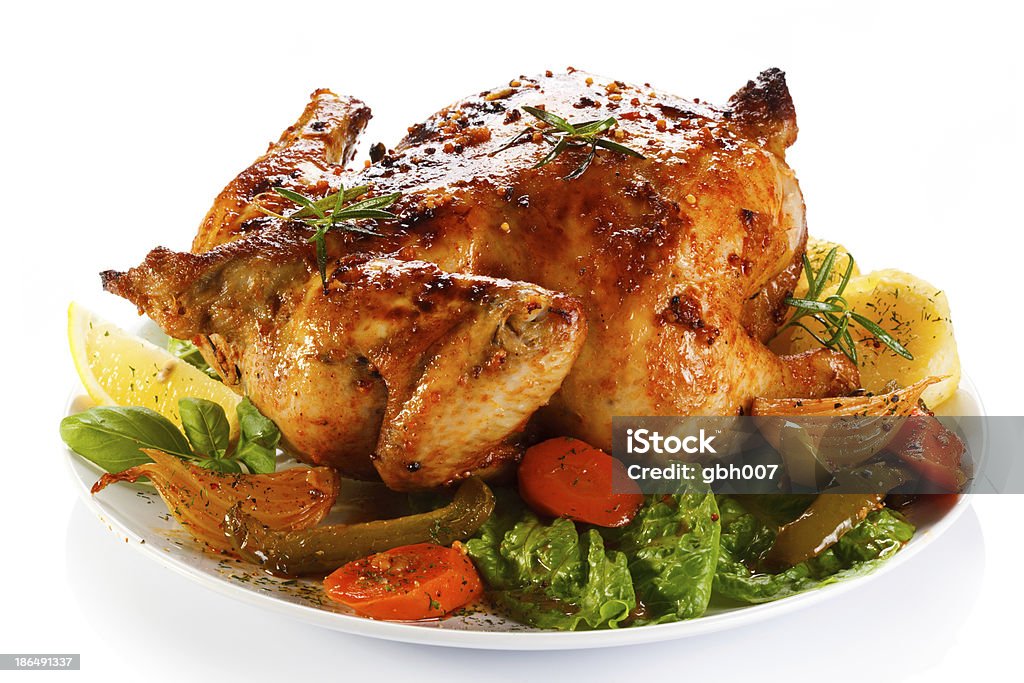 Close-up of a roasted chicken with vegetables Roasted whole chicken  Roast Chicken Stock Photo