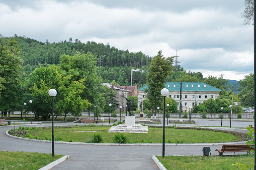 Zlatoust, Russia - June 20, 2023: City garden, historical monument to Lenin, monument to 27 Bolsheviks. Downtown. Cityscape on cloudy summer day