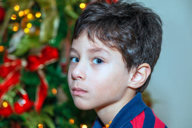 Young boy (6) in looking at camera.