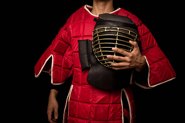 istock Eskrimador stick-fighter on black background 186495140