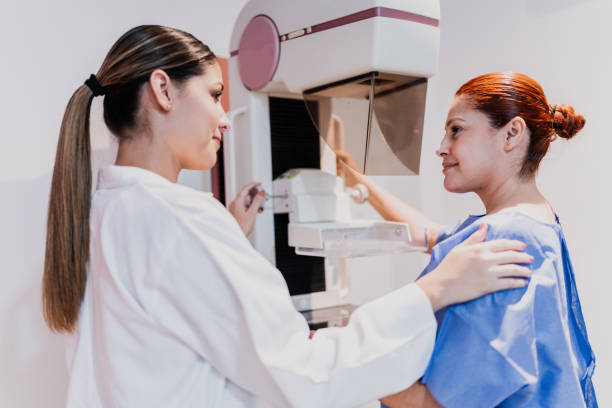 istock Doctor doing mammogram exam on patient at hospital 1865003706