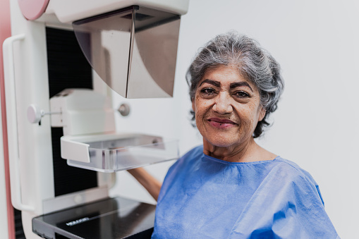 Portrait of a senior woman on a mammogram exam at hospital