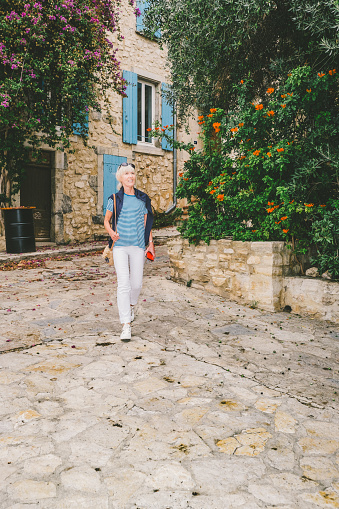 Female tourist at the village of Bages south of Narbonne in the Languedoc region of France.