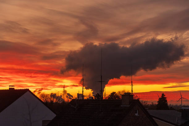 istock Industrial Water Vapor rising into Sunset Sky 1865015039