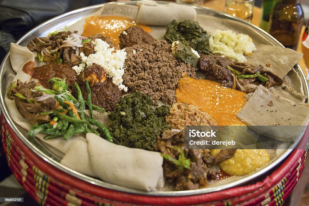 Injera be wot, traditional Ethiopian Food Traditional Ethiopian Food, Several types of stew and meat served on Injera Injera Stock Photo