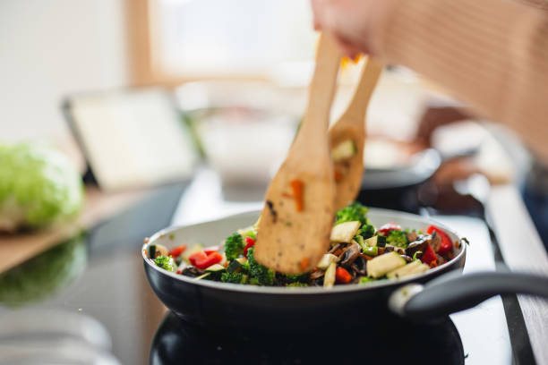 istock Couple Cooking Healthy Meal Together in Kitchen 1865033200