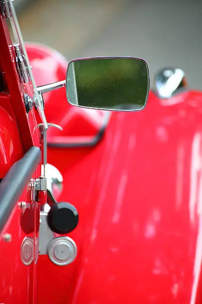 cropped image of a fully restored classic old car with lots of shiny chrome
