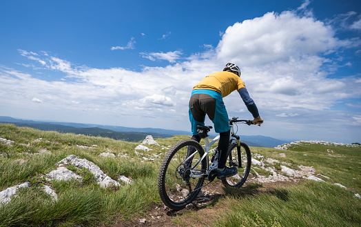 Woman ride a bike: summertime activity