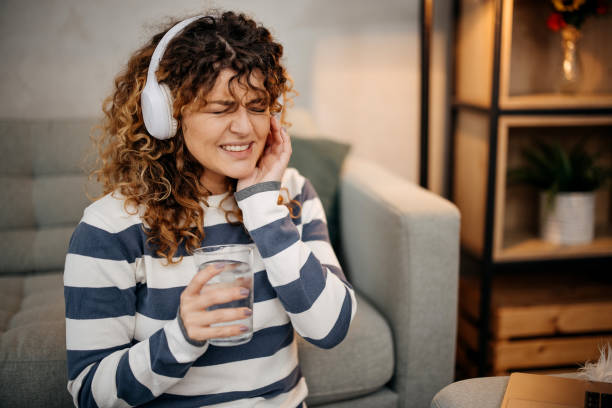 istock Woman feeling teeth pain 1865082179