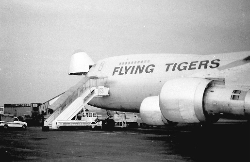 Boeing 747 of the US American cargo airline (photo from 1985) Flying Tiger Line (ceased operations in 1989) stands with open nose flap at Bordeaux airport waiting for its cargo of live horses