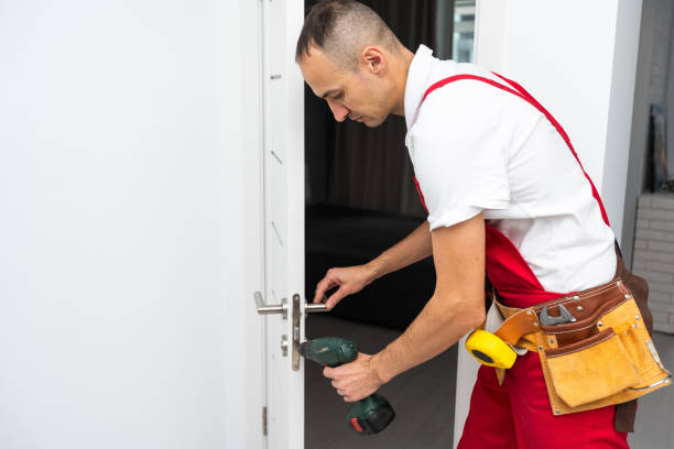 istock Young man worker confident repairing door at home 1865114973