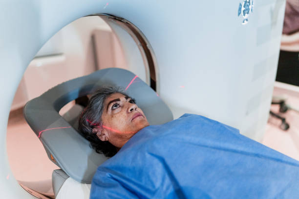 senior woman on a tomography exam at hospital - mri scanner healthcare and medicine medical exam brain zdjęcia i obrazy z banku zdjęć