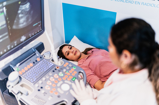 Mid adult woman on ultrasound exam at hospital