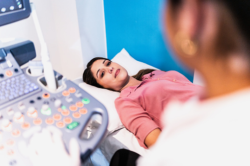 Mid adult woman on ultrasound exam at hospital