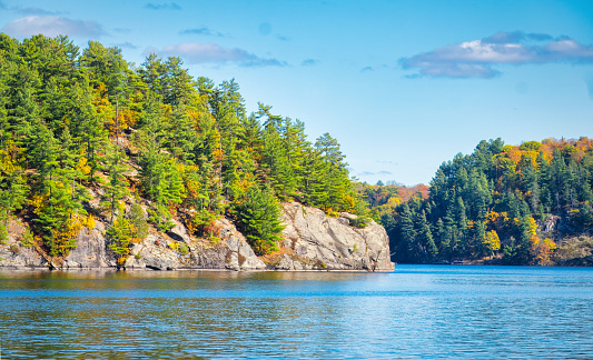 Scenic autumn view of rock islands in Mary Lake, Port Sydney, Muskoka District, Ontario, Canada