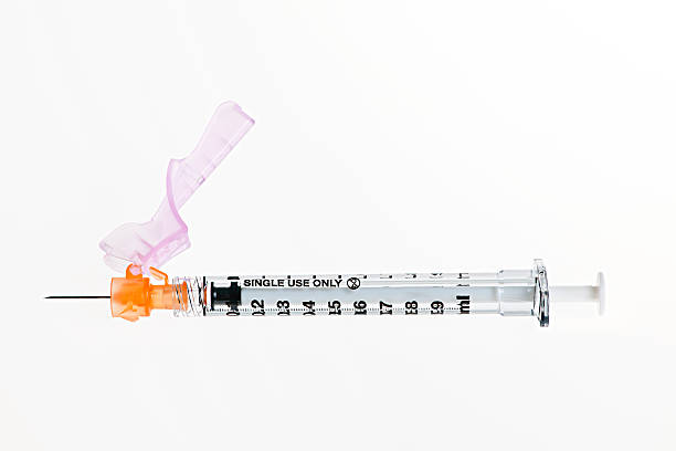 Syringe over white stock photo