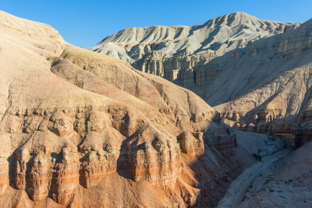 istock Picturesque mountains made of layered compressed dry clay 1865143442