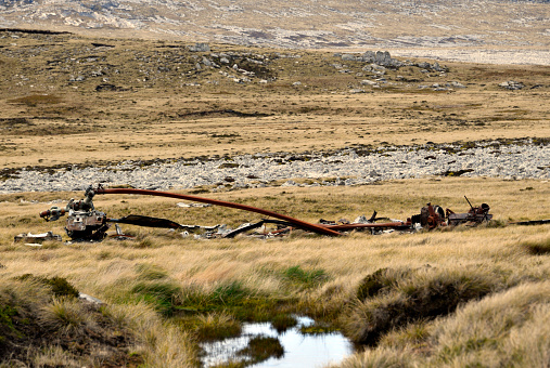 Mount Kent, East Falkland, Falkland Islands: Argentinian CH-47C Chinook helicopter wreckage, the helicopter was strafed by Hawker Siddeley Harrier GR.3 XZ963 while on the ground - the mangled parts including turbines and blades still lie strewn across the fields - 1982 Falklands war battlefield.