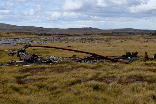 Mount Kent, East Falkland, Falkland Islands: Argentinian CH-47C Chinook helicopter wreckage, the helicopter was strafed by Hawker Siddeley Harrier GR.3 XZ963 while on the ground - the rusting parts including turbines and blades still lie strewn across the fields - 1982 Falklands war battlefield.