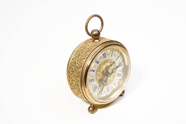 istock an old golden analog alarm clock with mechanical movement 1865174566