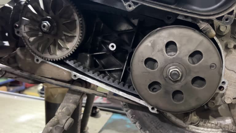 Close-up of mechanic repairing motorcycle.