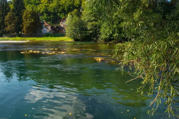 The River Una as it passes through Kulen Vakuf village in the Una National Park. Una-Sana Canton, Federation of Bosnia and Herzegovina. Early September