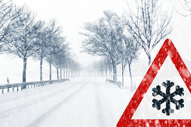 istock Snowy road with traffic sign 186518378