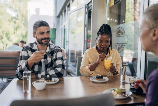 istock Friends enjoying in dessert 1865184619