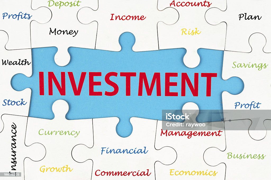 Investment words Investment concept words on group of jigsaw puzzle pieces Business Stock Photo