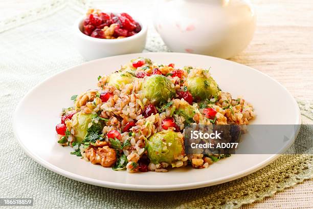 A Plate Full Of Warm Buckweat Salad With Brussel Sprouts Stock Photo - Download Image Now