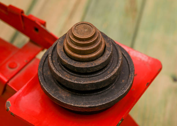 Old weight machine with steel bars isolated closeup view