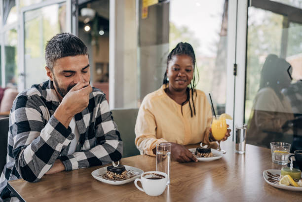 istock Man and woman in restaurant 1865222402