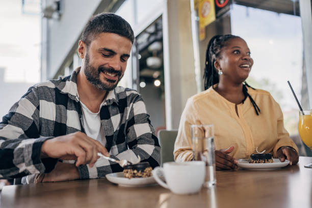 istock Man and woman in restaurant 1865224083