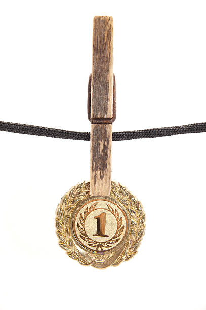 istock medal, clothespin and rope on a white background 186522525